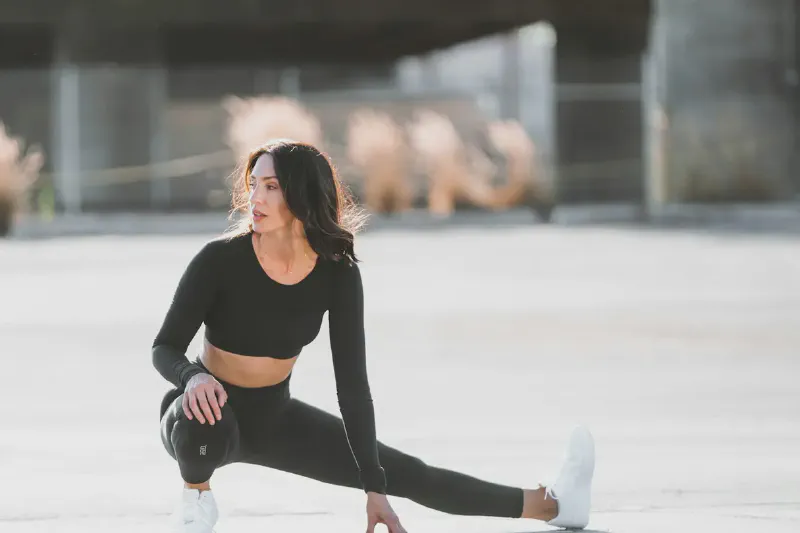 Three types of resistance bands: loop, tube with handles, and flat therapy bands laid out on a mat
