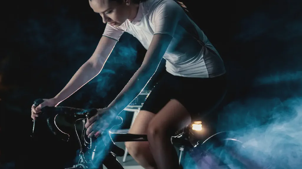 A home exercise area with an upright exercise bike positioned beside a wall